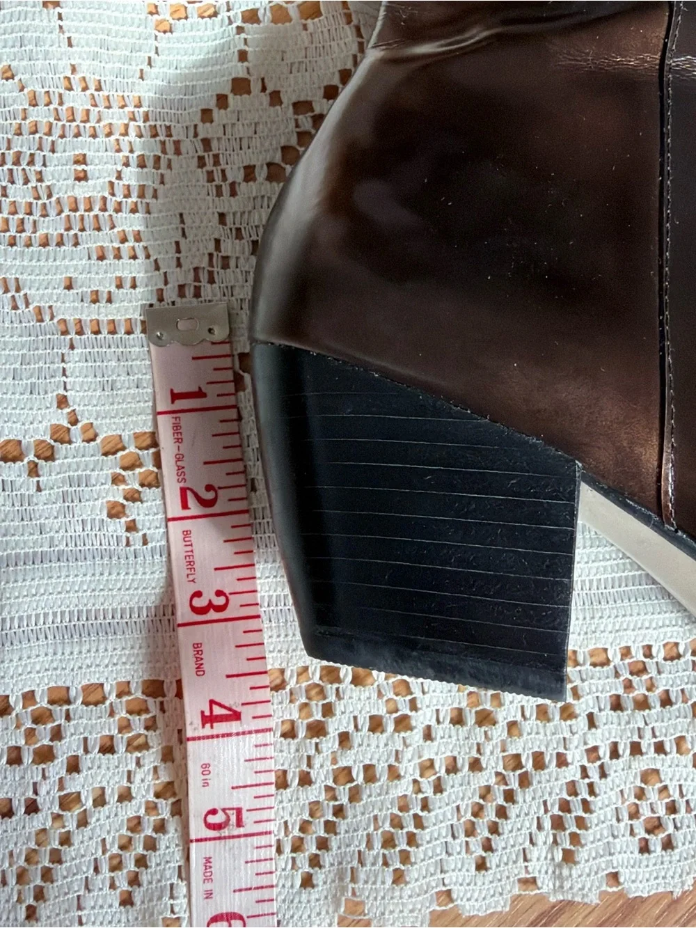 Brown leather boots with a pointed toe